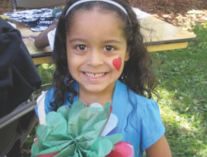 Child holding a flower