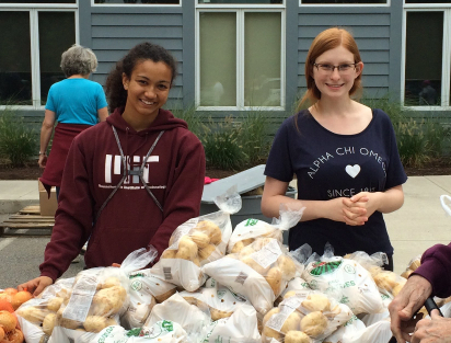 two volunteers at a food bank