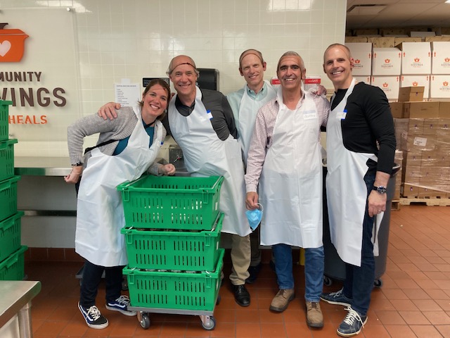 A team of volunteers at Community Servings, ready to cook.