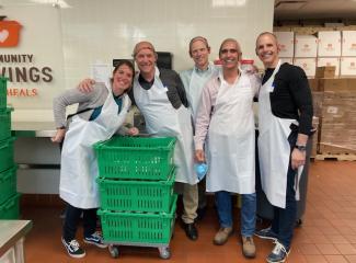 A team of volunteers at Community Servings, ready to cook.